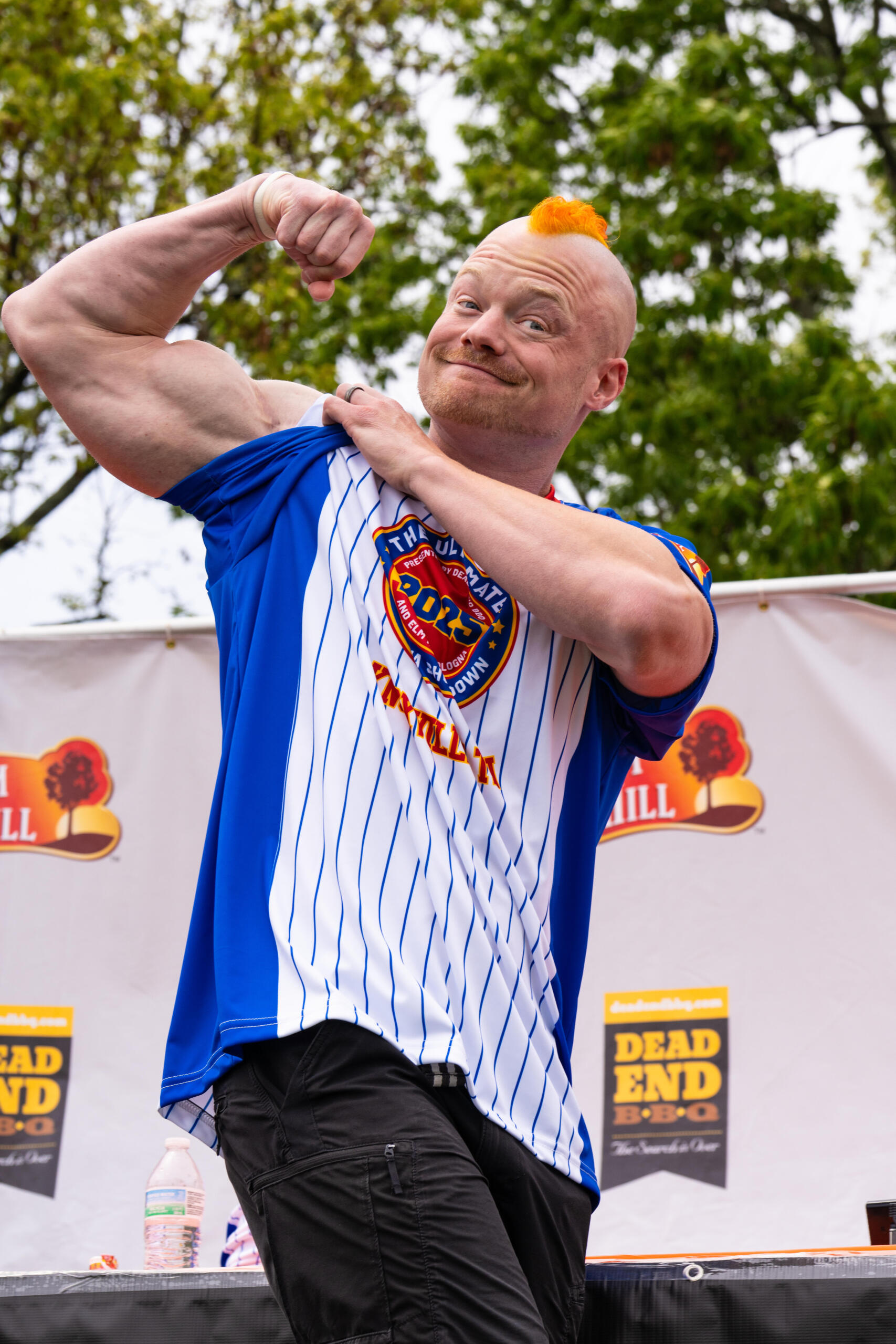 a contestant in the ultimate bologna showdown showing his might. the ultimate bologna showdown in an annual event in knoxville, tn out on by a local bbq restaurant.